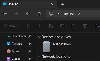 Closeup of computer files window showing This PC and Devices and Drives